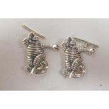 A pair of novelty sterling silver cufflinks in the form of the Michelin Man