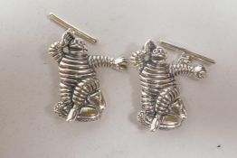 A pair of novelty sterling silver cufflinks in the form of the Michelin Man