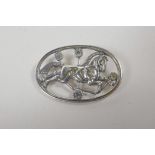 A Danish sterling silver brooch decorated with a horse, 1½" wide