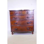 A Victorian mahogany bowfront chest of two over three drawers, with turned wood handles, raised on