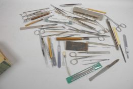 A box of medical dissecting tools etc