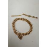 A 9ct gold chain bracelet with padlock clasp, 15.5g, and two 9ct gold tie clips, 19g gross