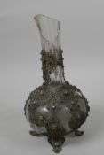 A Russian crystal glass flask in a filigree metal case set with small enamelled studs, A/F, 9½" high