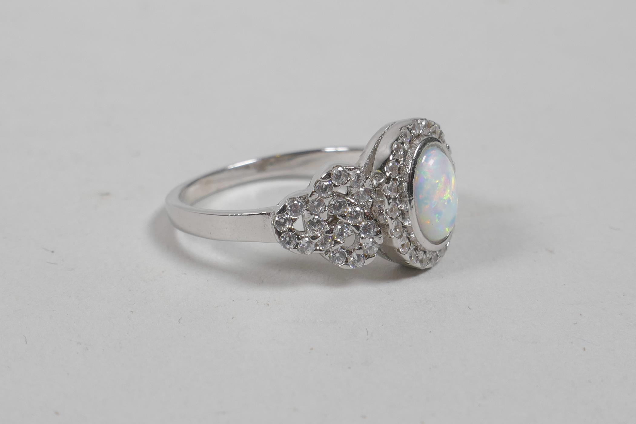 A silver, cubic zirconium and opalite panelled ring, approximate size 'P' - Image 2 of 2