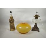 A Troika style Trethevy Pottery lamp, a 'Wright & Butler' oil lamp converted to electricity, and a