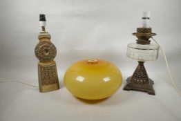 A Troika style Trethevy Pottery lamp, a 'Wright & Butler' oil lamp converted to electricity, and a