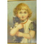 An oil on board portrait of a young girl with a kitten in her arms, 7½" x 9½"