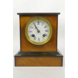 A c.1900 burr walnut and ebonised mantel clock, possibly French, with flat ebonised top and