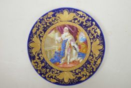 A Continental porcelain cabinet plate decorated with a printed regal portrait, a blue glazed rim and
