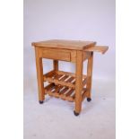 A pine butcher's block with a single drawer, slide and two wine rack under tiers, 26" x 19", 34"