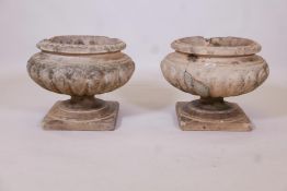 A pair of late C19th terracotta pedestal garden urns (possibly Portobello), 18" diameter