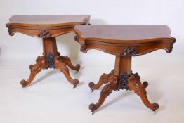 A pair of C19th Rosewood card tables with serpentine shaped tops and carved decoration, raised on