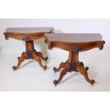 A pair of C19th Rosewood card tables with serpentine shaped tops and carved decoration, raised on