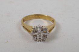 A 9ct yellow gold diamond set daisy style ring, approximate size 'N'