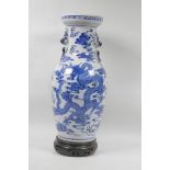 A Chinese blue and white dragon vase, with wood stand, 17" high, 6 character mark to base