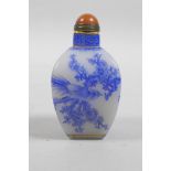 A Chinese white Peking glass snuff bottle with blue enamel decoration of Asiatic birds and flora,