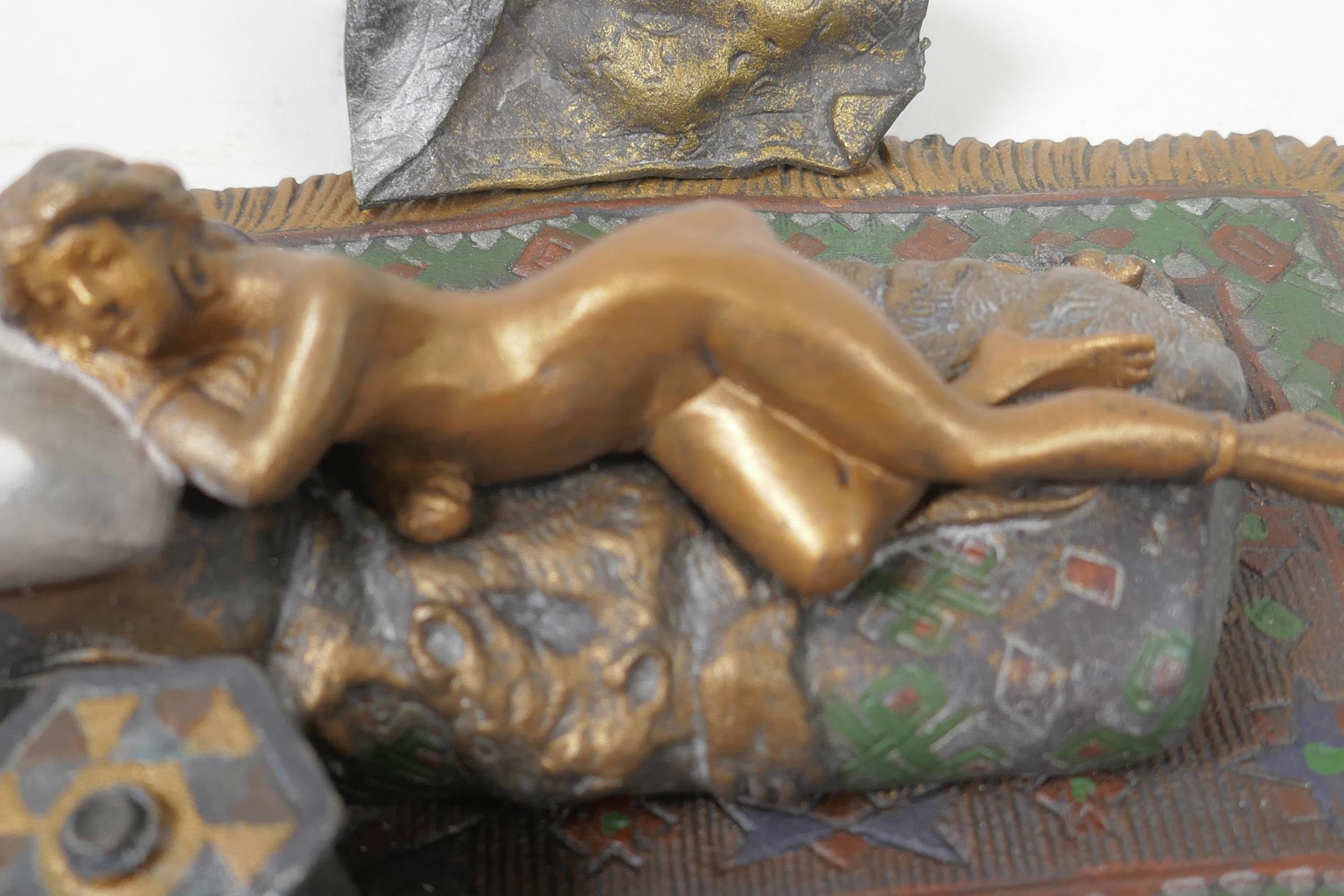 A cold painted bronze figure of a girl lying on a bed, 6¼" long - Image 3 of 4