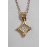 A 14ct yellow gold and diamond pendant on a 925 silver chain