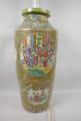 A tall Chinese Canton famille rose cylindrical vase decorated with panels of many figures in