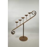 A wrought iron five stem sloping pricket candlestick, 22" high