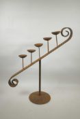 A wrought iron five stem sloping pricket candlestick, 22" high