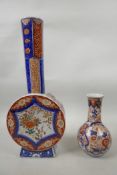 A C19th Chinese Imari vase with floral decoration in blue and red with gilt highlights, 6" high x