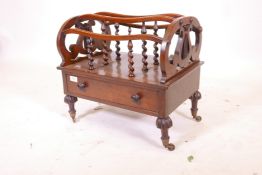 A mid C19th rosewood canterbury, with single drawer and lyre shaped ends, raised on turned