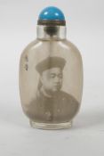 A Chinese reverse decorated snuff bottle depicting an emperor, inscription verso, 3½" high