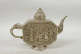 A Chinese white metal teapot with raised decoration of three figures in a garden, impressed four