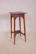 An Arts and Crafts mahogany plant stand, the top inlaid with geometric pattern in various woods,