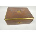 A brass bound military style rosewood box with military inset brass handles, containing vintage