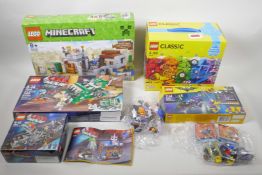 A quantity of Lego sets to include Minecraft 21121, Classic 10715, The Lego Movie - Trash Chomper