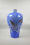 A large Japanese blue ground porcelain baluster vase with blue crystalline glaze and red carp