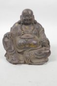 A Chinese bronzed metal rotund Buddha with gilt patina, 5" high