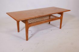 A Danish teak two tier coffee table by Trioh Co, with solid top and openwork undertier on four