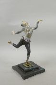 An Art Deco style cold painted bronze figure of a dancing woman with carved ivorine hands and