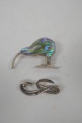 A sterling silver brooch set with abalone in the form of a kiwi, and another silver brooch set