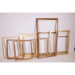 A collection of ten gilt picture frames and slips, largest 40" x 20"