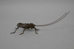 A Japanese Jizai style bronze of a cricket with articulated limbs and antenna, 6" long