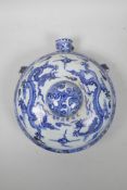 A Chinese blue and white traveller's flask, with twin dragon decoration, 6 character mark to side,