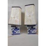 A pair of Chinese blue and white porcelain headrests used as lamp bases, 5¼" high, fitted with
