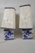 A pair of Chinese blue and white porcelain headrests used as lamp bases, 5¼" high, fitted with