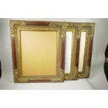 A set of three moulded and parcel gilt picture frames, containing prints of female nudes, 16" x