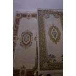 A Chinese deep pile wool rug, and another with similar pattern, 72" x 38"