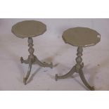 A pair of painted and gilt occasional tables with octagonal tops, turned supports and tripod feet,
