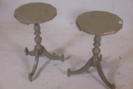 A pair of painted and gilt occasional tables with octagonal tops, turned supports and tripod feet,