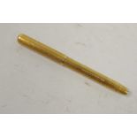 A rolled gold 'purse' fountain pen, with 9ct gold nib, 4" long