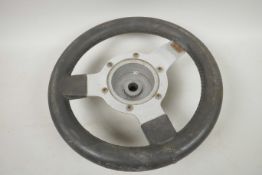 A Mountney aluminium three spoke steering wheel, 11" diameter, ex mini cooper