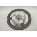 A Mountney aluminium three spoke steering wheel, 11" diameter, ex mini cooper