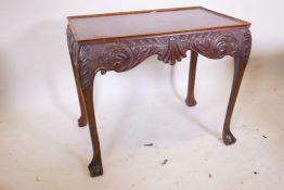 A mahogany Irish Chippendale style silver table, with tray top and carved frieze, raised on cabriole